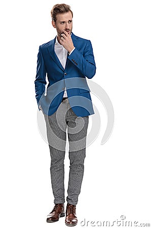 Eager casual man holding his hand in his pocket Stock Photo