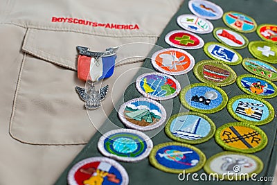 Eagle pin and merit badge sash on boy scout uniform Editorial Stock Photo