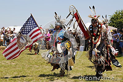 The Eagle Staff leads the Grand Entry at the NYC Pow Wow Editorial Stock Photo