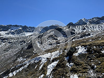 Early autumn remains of the alpine glacier Vardet da Grialetsch in the Albula Alps mountain massif, Zernez Stock Photo