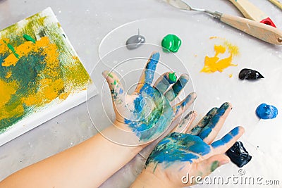 Early childhood education. Dirty little painter Stock Photo