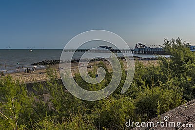 An early evening view from the cliff path along the beach at Clacton on Sea, UK Stock Photo