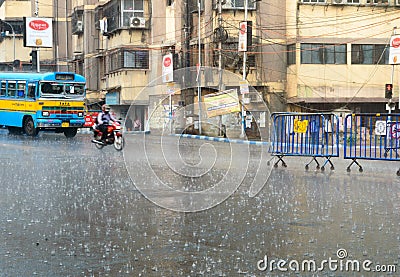 Early Monsoon rain falling on city street in a rush hour. Kolkata West Bengal India South Asia Pacific 6th April 2021 Editorial Stock Photo