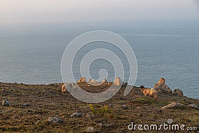 The early morning of camping Island, rocks and sunshine form a beautiful scenery Stock Photo