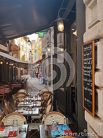 Restaurants in Cannes, France, with empty chairs and tables Editorial Stock Photo