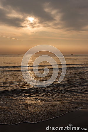 Early Morning at Dawn of the Day with a Calm Sea Overlooking the Sky Stock Photo