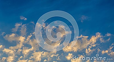 Early morning golden clouds on blue sky Stock Photo