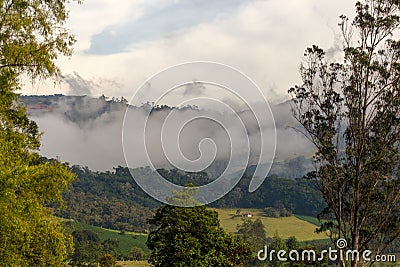 Early in the morning low clouds cover with mist the central Andean mountains Stock Photo