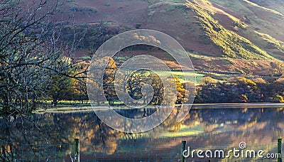 An early morning view of the mist lifting over Lake Buttermere Stock Photo