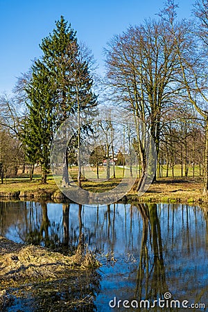 Early spring landscape of European forest and water ponds in Konstancin-Jeziorna Springs Park - Park Zdrojowy w Konstancinie Stock Photo