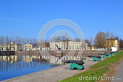Naval combat guns - ancient artillery pieces on the embankment of the Italian Pond in Kronstadt in early spring Stock Photo