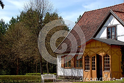 white bench in the village, idyllic spring landscape Stock Photo