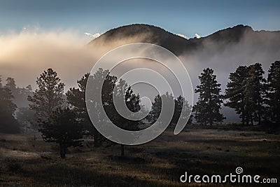 Foggy sunrise morning in the mountains Stock Photo