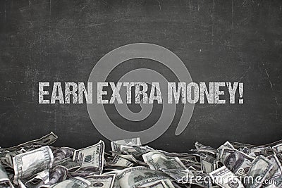 Earn extra money text on black background Stock Photo