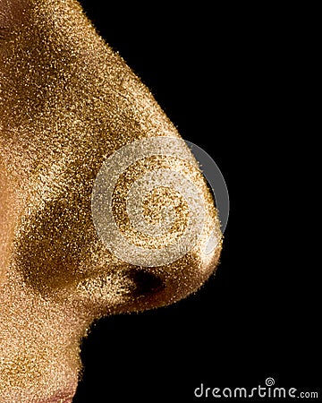 Earn a fortune - golden nose on black background Stock Photo