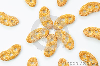 Ears cookies on white background, sweet pretzels, sprinkled with sugar, top view, isolated Stock Photo