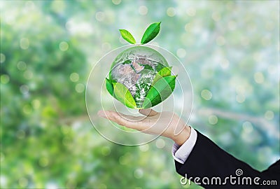 Earth day, Protect the world with environment and Eco-friendly business. Businessman hand holding globe with leaves. Element of th Stock Photo