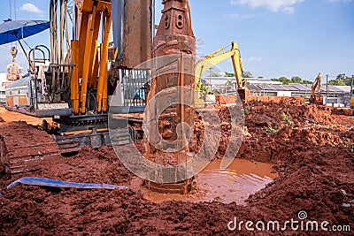 Earth drilling machine for drilling piles, Earth drilling machine or hydraulic boring machine into a construction site Stock Photo