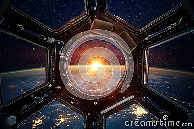Earth and galaxy in spaceship international space station window Stock Photo