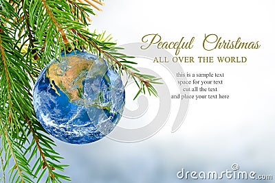 Earth globe as christmas bauble, metaphor for universal peace, e Stock Photo