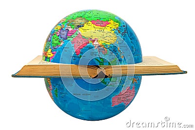 Earth globe divided by a book where you see Asia and Australia: concept of division and war. The open book symbolizes the cultures Stock Photo