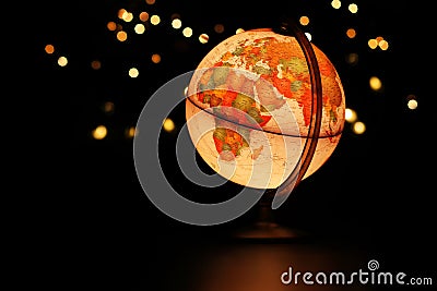 Earth globe glowing in dark starry sky Stock Photo