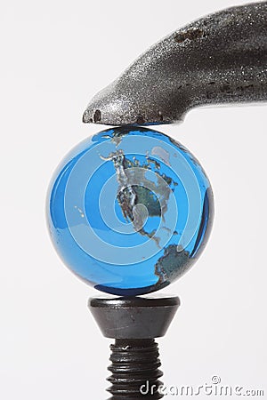 Earth Marble In Clamp Stock Photo