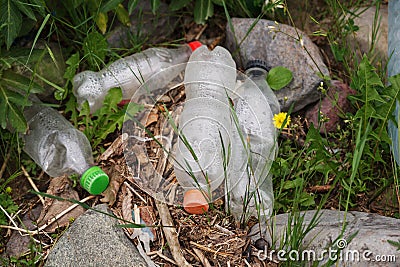 Earth nature pollution with plastic waste and water bottles Stock Photo