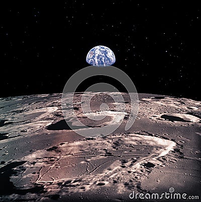 Earth rises above lunar horizon Stock Photo