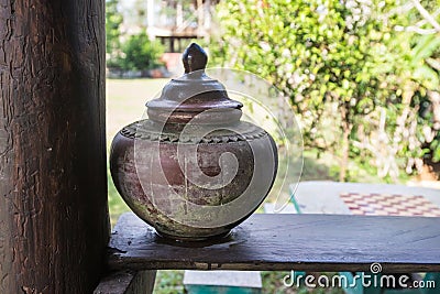 Earthen jar. Thailand in ancient times,earthen jar filled with water placed in front of a home Stock Photo