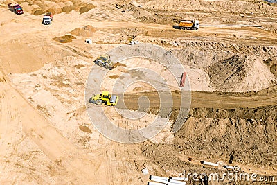 Earthmover preparing ground for future building construction. aerial photo Stock Photo