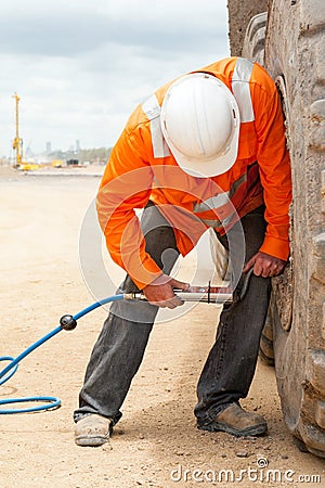Construction Machine Tyre Pressure Service Stock Photo