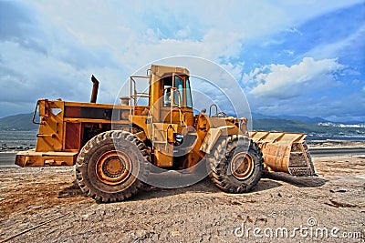 Earthmover working on construction site Stock Photo