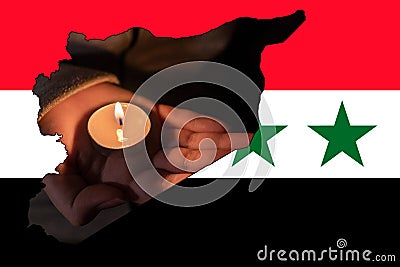 Earthquake in Syria. Burning candle in hand (close-up) Stock Photo