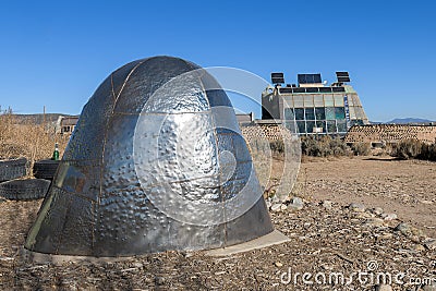 Earthship Biotecture home behind sculpture Editorial Stock Photo