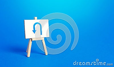 Easel with arrow turning back. Change plans, circumstances. Tactical retreat. Avoiding problems, reducing risks. Reassessment Stock Photo
