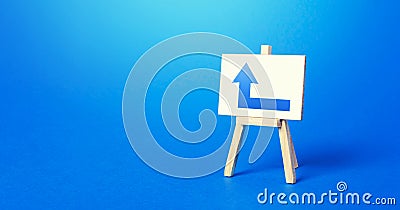 Easel with a blue left arrow. Direction to go around on the right. Advertising, indicating the location of the store object. Stock Photo