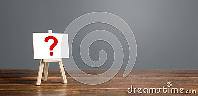 Easel with a question mark. Asking questions, searching for truth. Curiosity, learn and improve. mystery, investigation research Stock Photo