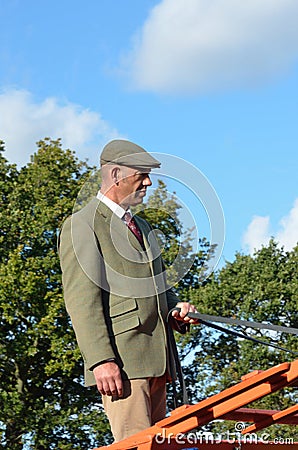 East Anglia Equestrian Fair English countryman holding reins of Carthorse Editorial Stock Photo