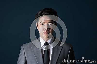 East Asian Businessman shooting studio portrait Stock Photo