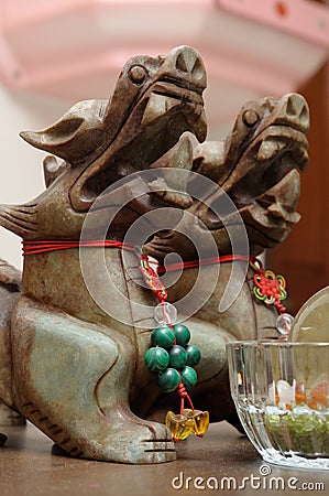 East Asian mythical statuettes on display Stock Photo
