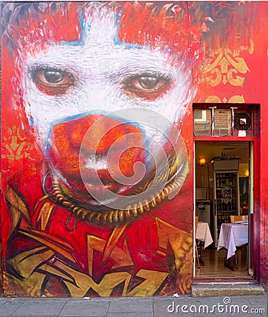 Cafe with unique portrait street art decoration Editorial Stock Photo