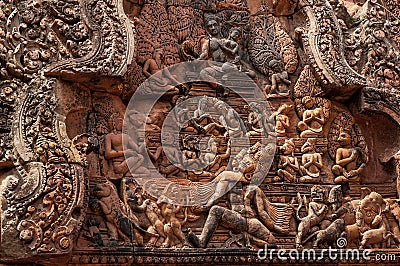 East-facing pediment on Southern Library of Banteay Srei shows Shiva and Uma seated on summit of Mount Kailash Stock Photo