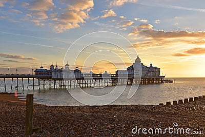 Eastbourne Pier at dawn with glorious golden sky Stock Photo