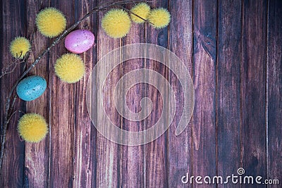 Easter background with colored eggs, branches and copy space Stock Photo