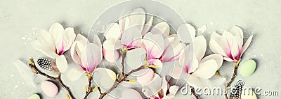 Easter composition with Spring magnolia flowers on grey stone background Stock Photo