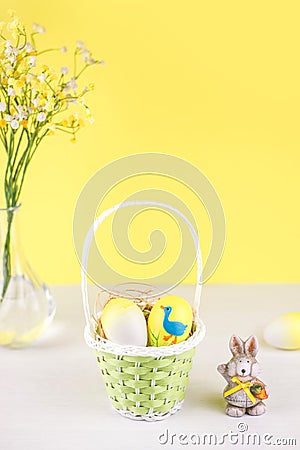 Easter basket with eggs on white background. Stock Photo