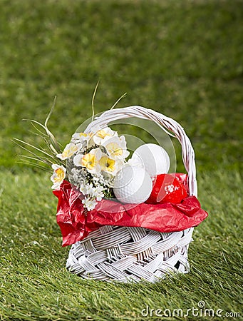 Easter Basket with Golf Balls and Flowers Stock Photo