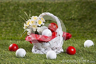 Easter Basket with Golf Balls and Flowers Stock Photo