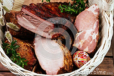 Easter basket with smoked meat. Stock Photo